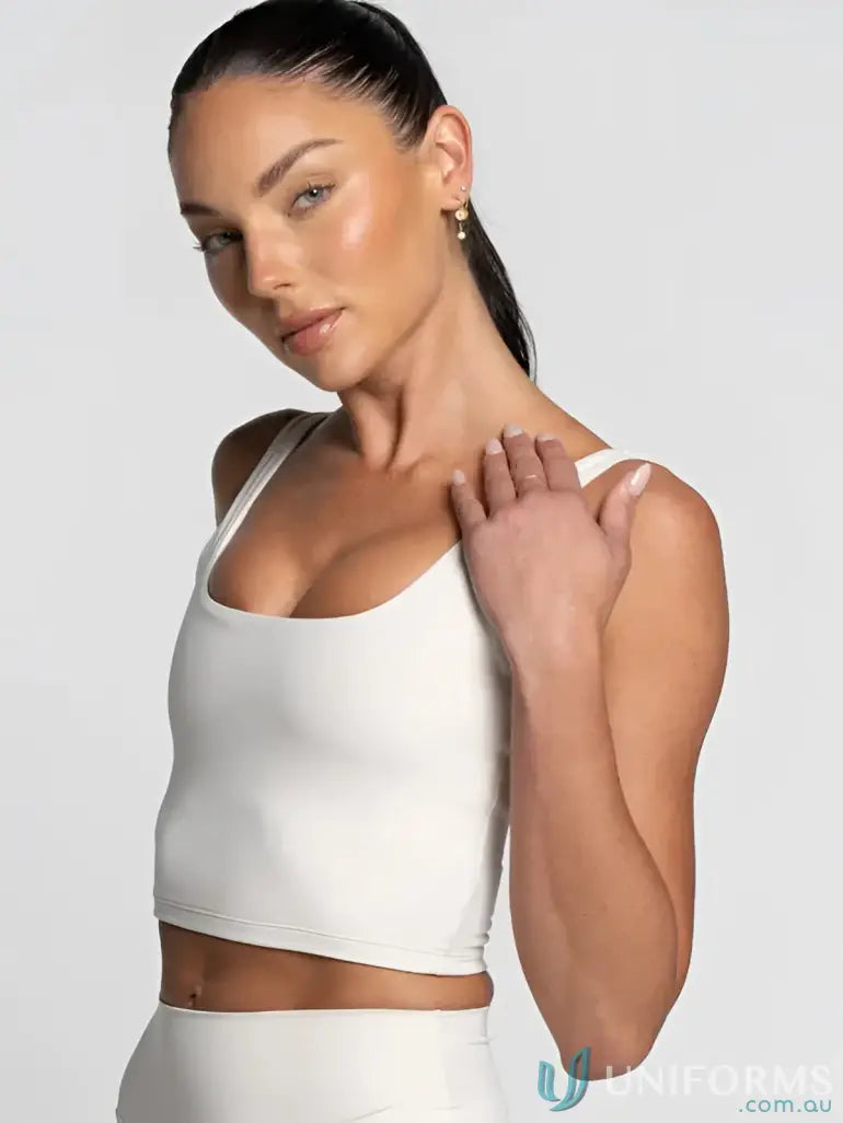 White cropped tank top with thin straps and square neck perfect for minimalist workwear and uniforms essentials