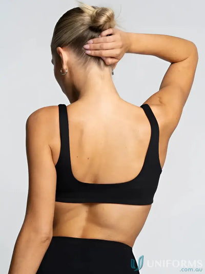 Black sports bra with thin straps and square back cutout perfect for work uniforms and active workwear