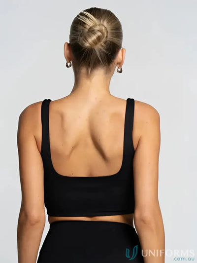 Back view of black cropped square neck onyx tank sports bra with thin straps perfect for work uniforms or workwear
