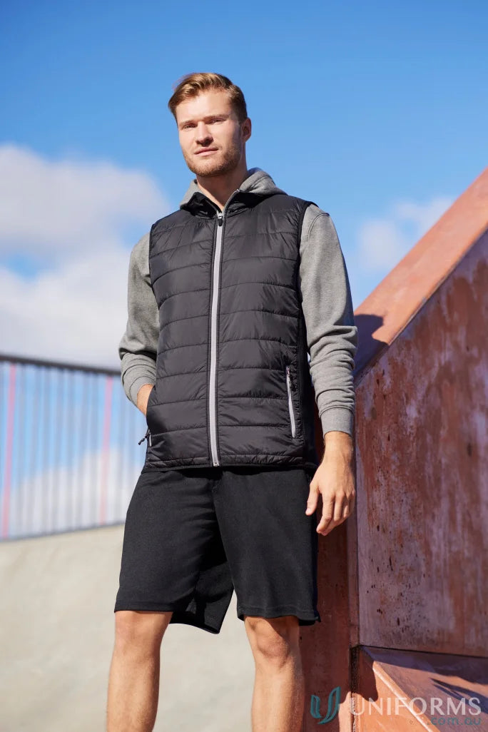 Man in black Stealth Vest featuring core warm PolyFil insulation, part of collection mens stealth