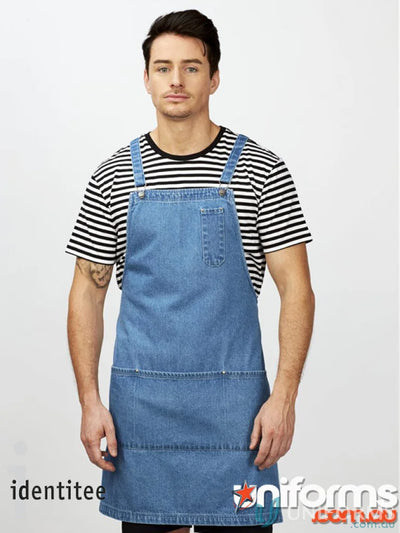 Man wearing light-wash denim apron with pockets over Stevie Stripe T-Shirt in workwear style