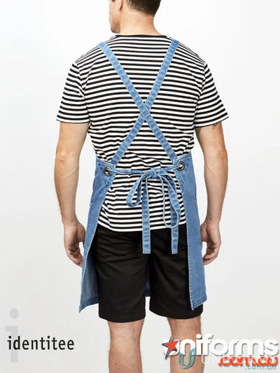 Person in black and white striped shirt wearing Stevie Stripe T-Shirt workwear white uniforms
