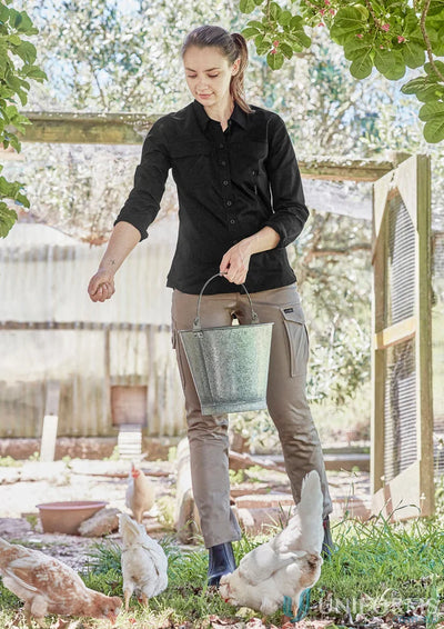 Green metal bucket with handle shown alongside 1Komma5 womens lightweight tradie shirt ideal for work uniforms and workwear