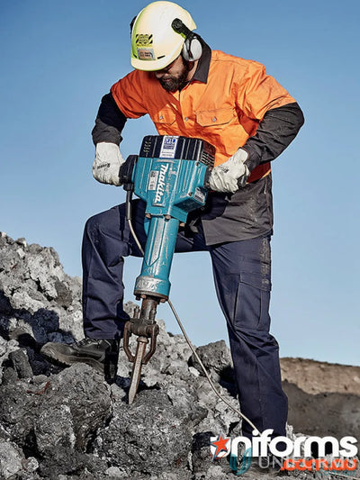 Man using jackhammer in Syzmik Mens Cargo Pants ZP501 with reinforced stress points