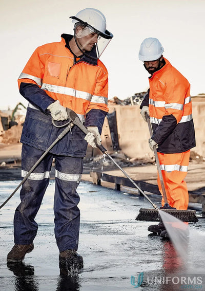 Workers cleaning outside wearing Syzmik Day/Night Quilt Lined Storm Jacket with chest pocket