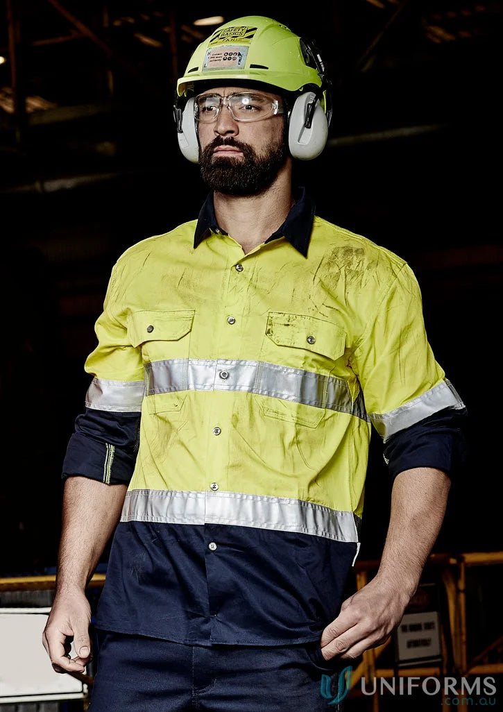 Man in safety gear wearing Syzmik Mens Industrial Long Sleeve Shirt Hoop Taped zw123 for demanding work environments
