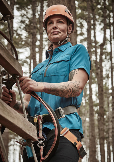 Syzmik Outdoor Ladies orange Petzl helmet on women’s outdoor short sleeve shirt