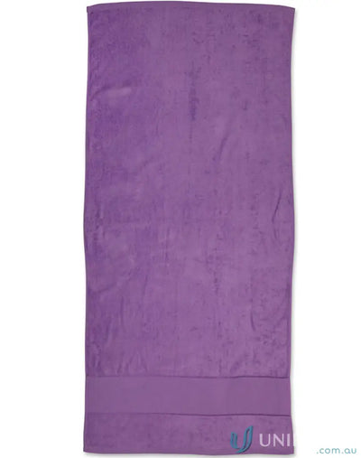 Purple plush towel from Terry Velour Beach Towel collection perfect for relaxing beach days