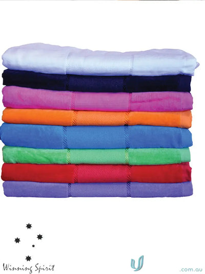 Colorful stack of terry velour beach blankets, perfect velour beach towel for summer