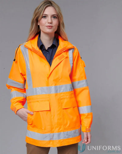 Woman wearing bright orange VIC Rail 3in1 Safety Jacket with reflective strips