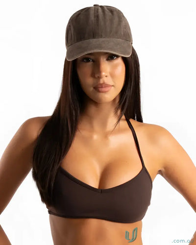 Brown baseball cap with adjustable strap and curved brim.