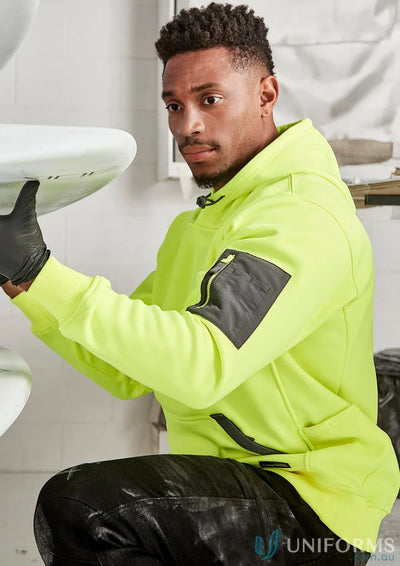 Man in neon yellow water resistant hoodie made of soft fleece for unisex style