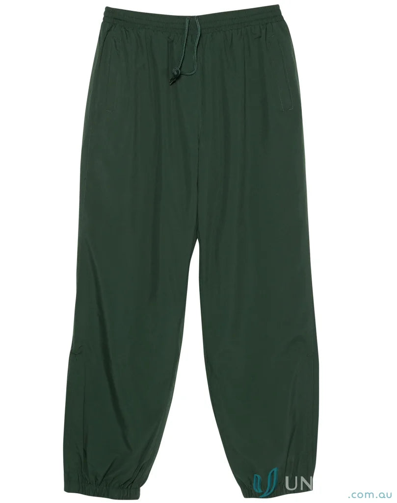 Dark green kids legend warm pants with zip-up leg openings from Winning Spirit Kids