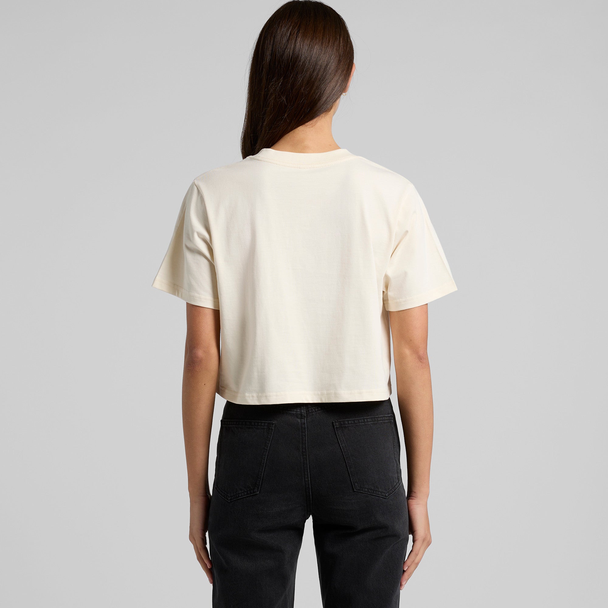 Cream-colored cropped tee with short sleeves and round neckline perfect for casual workwear or stylish work uniforms