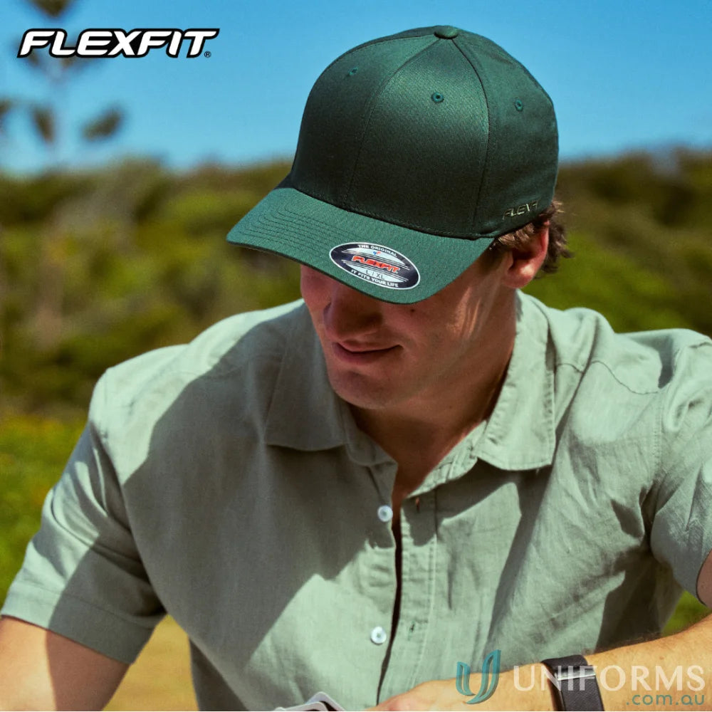 Dark green Worn By The World Flexfit Cap with athletic shape silver