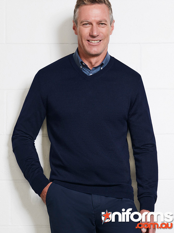 A man in a Navy Roma Knit V-neck sweater, showcasing a classic and relaxed style.