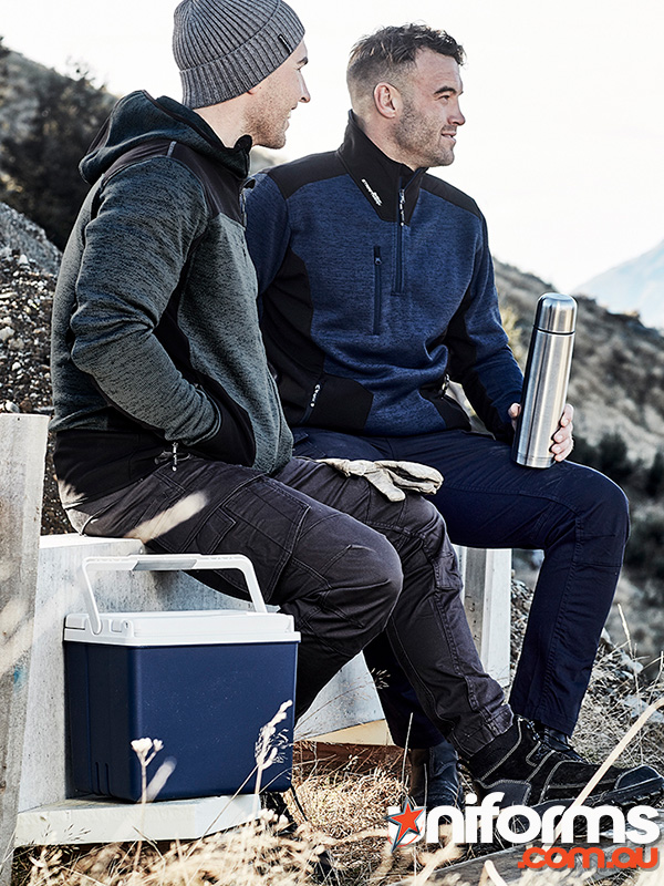 Two men seated on a bench beside a cooler, wearing Syzmic brand Unisex Streetworx 1/4 Zip Pullovers.